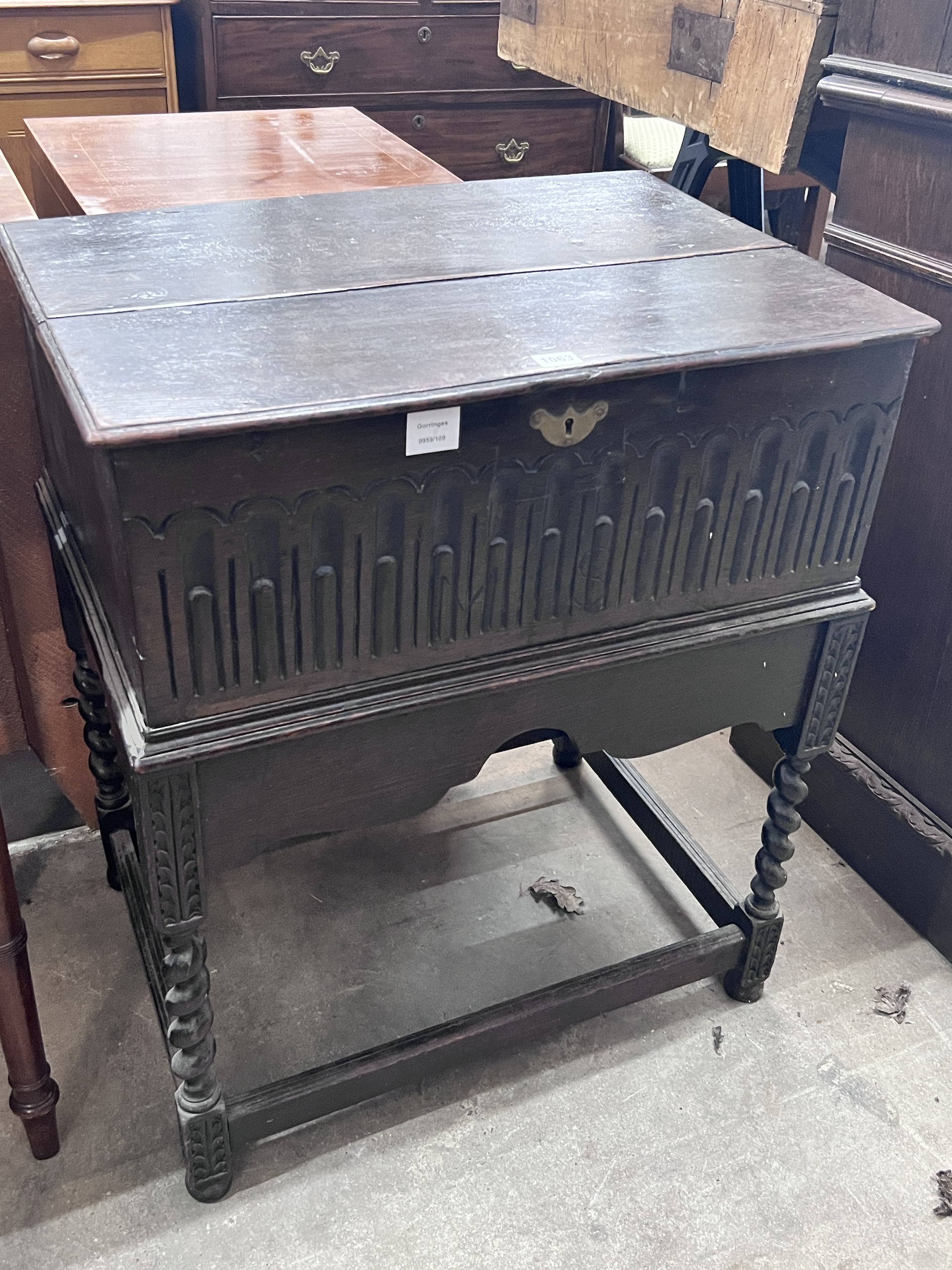 A 17th century style oak bible box on associated stand, width 68cm, depth 49cm, height 80cm